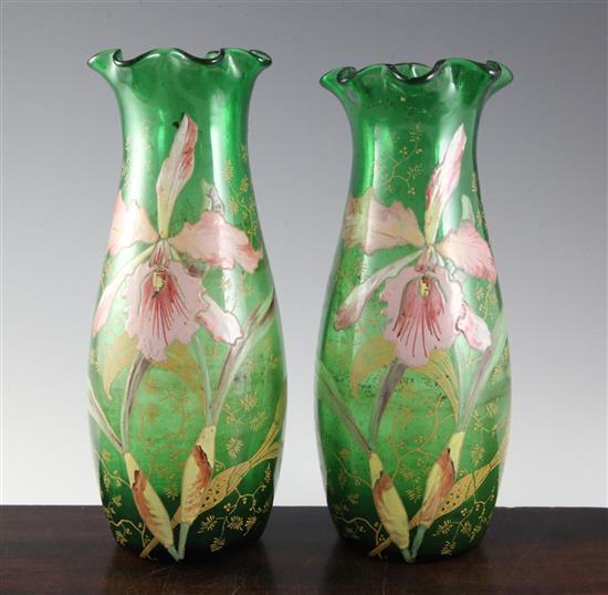 A pair of Bohemian or French enamelled green glass vases, c.1910, height 29.2cm (11.5in.)